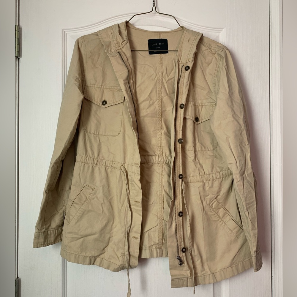 This is a tan coat that would be perfect for this rainy weather for the spring!
